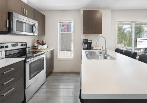a kitchen with a sink and a counter top at 5 STAR Business Luxury Homeshare in Edmonton