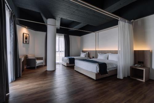 Säng eller sängar i ett rum på Impiana by Roxy Hotel