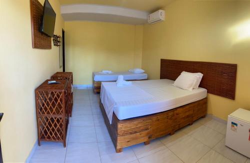 Giường trong phòng chung tại Águas de Sauípe