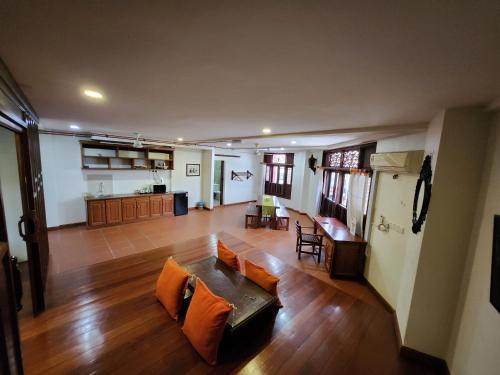 a living room with a couch and a table at Uptown Eco Hotel in Kuala Terengganu