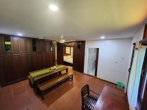 an empty room with a ping pong table in it at Uptown Eco Hotel in Kuala Terengganu