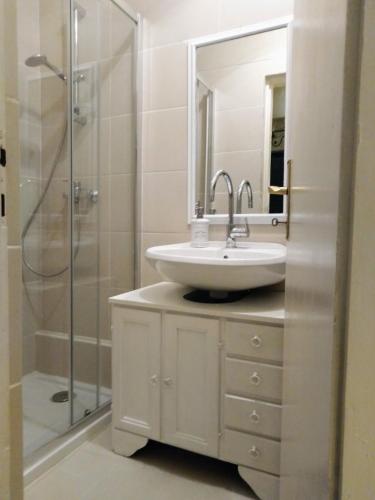 a bathroom with a sink and a shower at Villa Victoria in Gradac