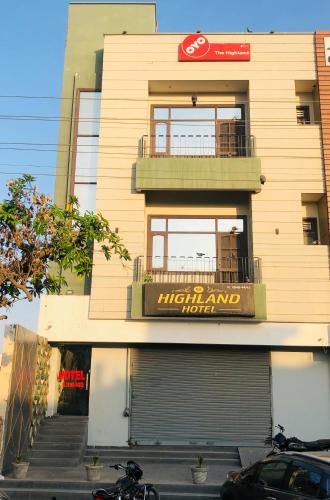 a building with a highland home sign on it at The highland hotel in Bathinda