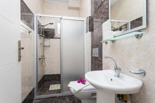 a bathroom with a toilet and a sink and a shower at Villa Casa Mia in Dalyan