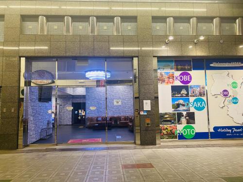 an entrance to a building with a glass door at ホリディパールホテル in Osaka