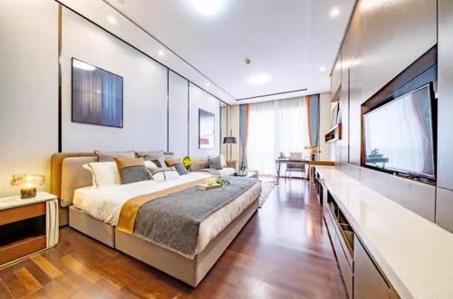 Katil atau katil-katil dalam bilik di Millenia Executive Apartment Guangzhou East Railway Station Zhujiang New Town Branch - Free Shuttle Bus to Canton Fair Complex During Canton Fair Period