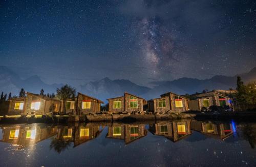 a row of houses at night with the milky way at LOKAL Rooms x Skardu (Katpana Retreat) in Skardu