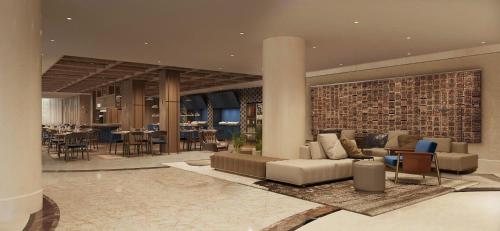 a living room with a couch and a dining room at Holiday Inn Express Beijing Downtown by IHG in Beijing