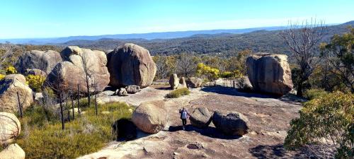 a person standing on top of a rock formation at Girraween Country Inn in Ballandean