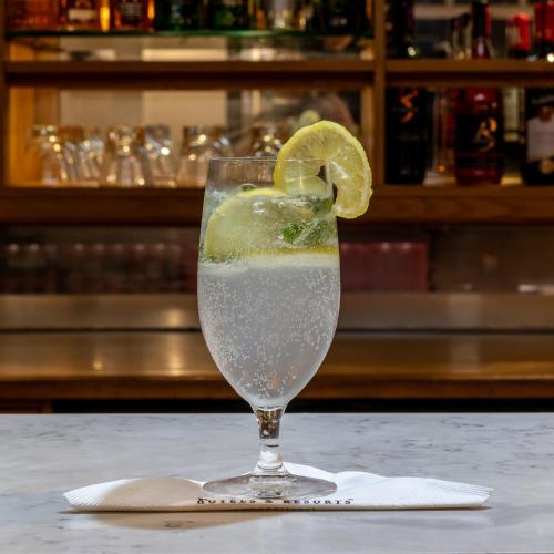 a drink with a slice of lime in a glass at Premier Express Inn George in George