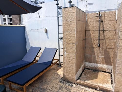 a shower with a blue bench and a ladder at 4a-lovely 2bedroom3baths In Bangkok City Downtown in Makkasan