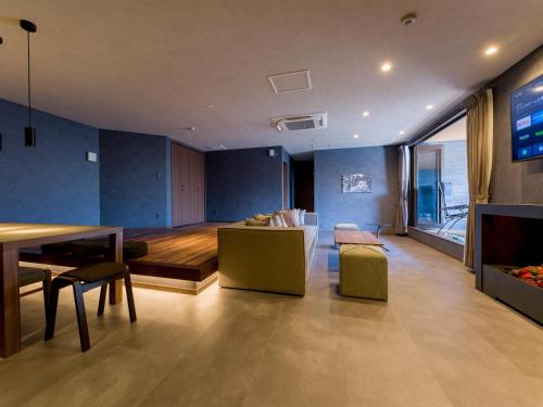 a living room with a couch and a table at Rakuten STAY VILLA Nasu in Nasu