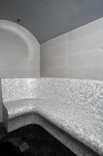 a bathroom with a large bath tub in a room at Villa Rita Pool & Spa in Mascalucia