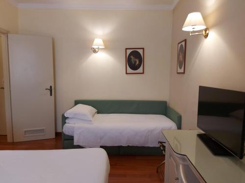 Postel nebo postele na pokoji v ubytování PHI Hotel Canalgrande