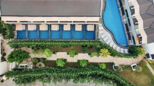 an overhead view of a building with a pool at Ölüdeniz Blu Luxury Unique Hotel - Adults-Only in Oludeniz