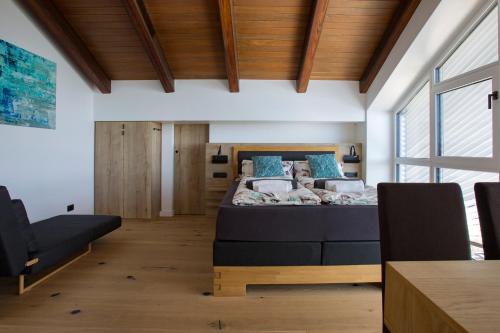 a bedroom with a bed and a large window at Villa Rita Pool & Spa in Mascalucia