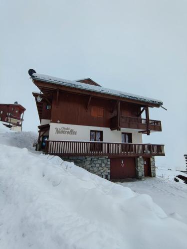 a building with snow in front of it at Exclusive Chalet Val Thorens Center by GlobalSki in Val Thorens