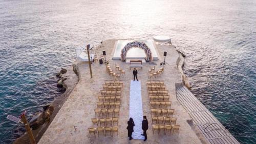 an overhead view of a wedding ceremony on the water at TRACADERO Beach Club & Holidays Rentals in Bayahibe