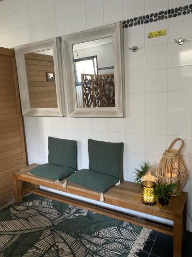 a bench in a room with a mirror at Saint Jean in Wimereux