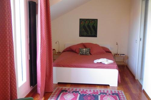 A bed or beds in a room at Teodora B&B