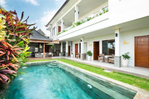 a swimming pool in the backyard of a villa at Bali Harmony Retreat in Canggu