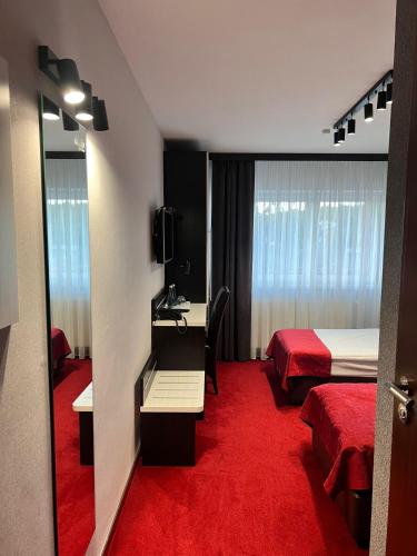 Postel nebo postele na pokoji v ubytování Hotel Olimp