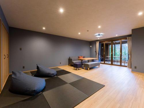 a living room with a couch and a table at Rakuten STAY VILLA Nasu in Nasu