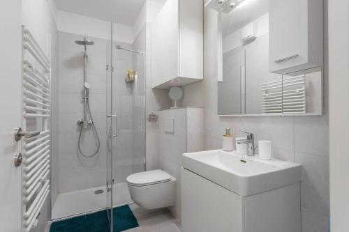 a bathroom with a toilet sink and a shower at Luxury & Elegance 2BDR Apartment in Zagreb