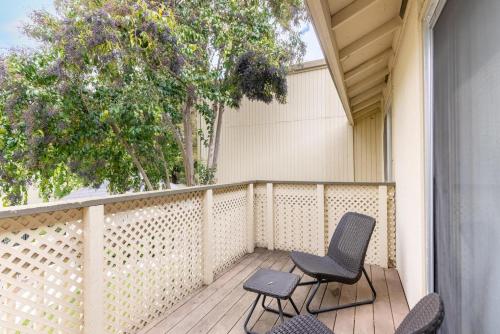 two chairs and a table on a porch with trees at Fremont 1br w parking balcony nr groceries SFO-1508 in Fremont