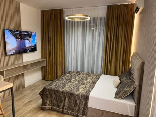 Postel nebo postele na pokoji v ubytování APARTMANI PENTHOUSE BULEVAR