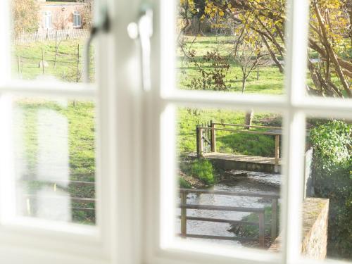 a view of a bridge from a window at Pass the Keys Converted Hop House Apt - Old Amersham - Chilterns in Amersham