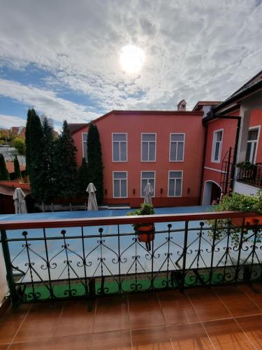 a view from the balcony of a building with a pool at Pensiunea Korona in Miercurea-Ciuc