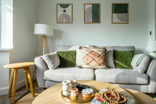 a living room with a couch and a table at The Birdie in York