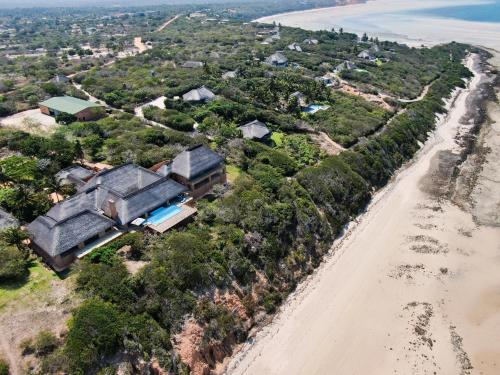 an aerial view of the house and the beach at Collection Luxury Accommodation: Quinta Do Sol, Vilanculos, Mozambique in Vilanculos