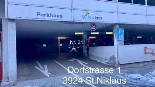 an empty parking lot in a parking garage at Ferienwohnung Morgengruss in Sankt Niklaus