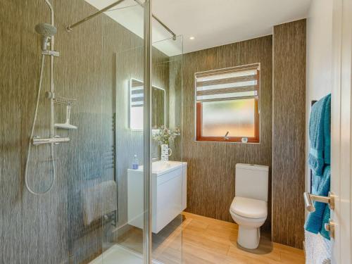 a bathroom with a toilet and a glass shower at 2 bed property in Nairn The Highlands 89176 in Nairn