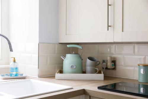 a kitchen counter with a mixer on a counter top at Canon Gate in Chichester
