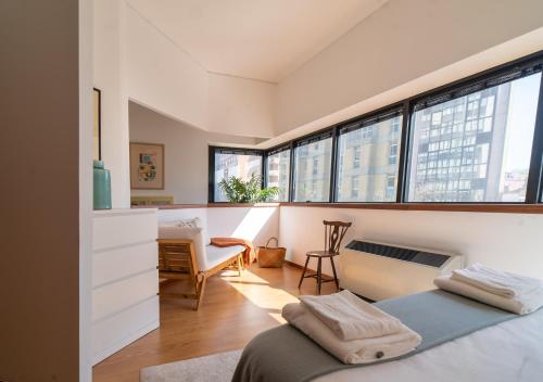 Postel nebo postele na pokoji v ubytování Lovely porto studios