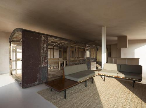 a living room with a couch and a table at Channel View, Dungeness by Bloom Stays in Dungeness