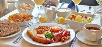 a table with a plate of breakfast food on it at Atlantic House in Lisdoonvarna