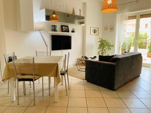 a living room with a couch and a table at A Casa Di Carolina in Cassino