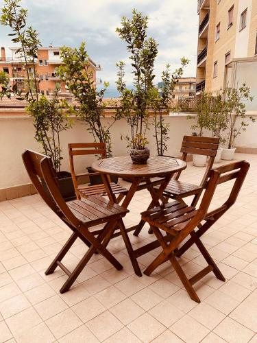 a wooden table and two chairs and a table and chairs at A Casa Di Carolina in Cassino