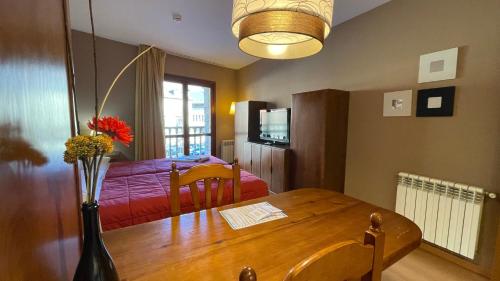 Katil atau katil-katil dalam bilik di Apartamentos Los Lagos