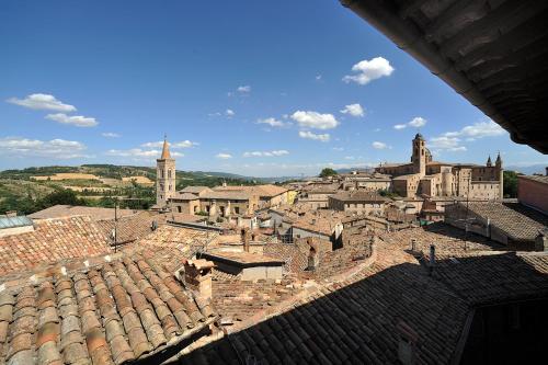 a view of a city from the roof of a building at Hotel Raffaello - Self Check-in Free in Urbino