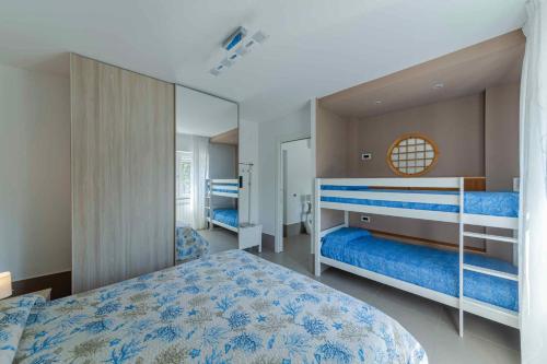 a bedroom with two bunk beds and a mirror at Apartment in Pozzuoli/Kampanien 26861 in Pozzuoli