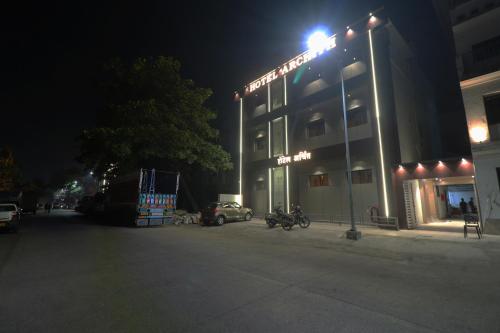 a street light in front of a building at night at Hotel Archith in Navi Mumbai