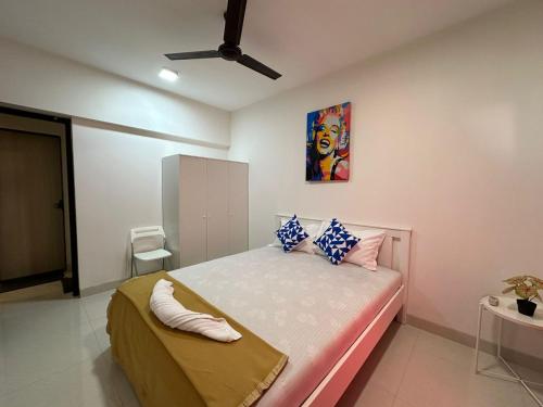 a bedroom with a bed with a painting on the wall at 1bed room Mumbai theme Lower Parel in Mumbai