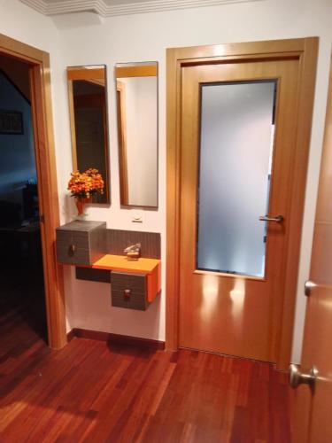 a bathroom with a sink and a mirror at La casita de Miguel, con garaje y piscina in Zamora