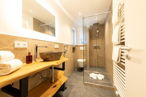 a bathroom with a sink and a shower at Bergjuwel in Garmisch-Partenkirchen