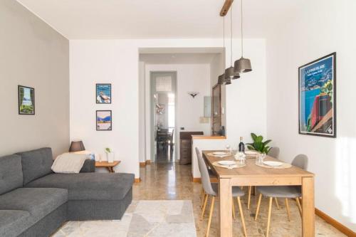 a living room with a couch and a table at Lake & The City in Como